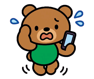 スマホを持って焦るお父さんくま